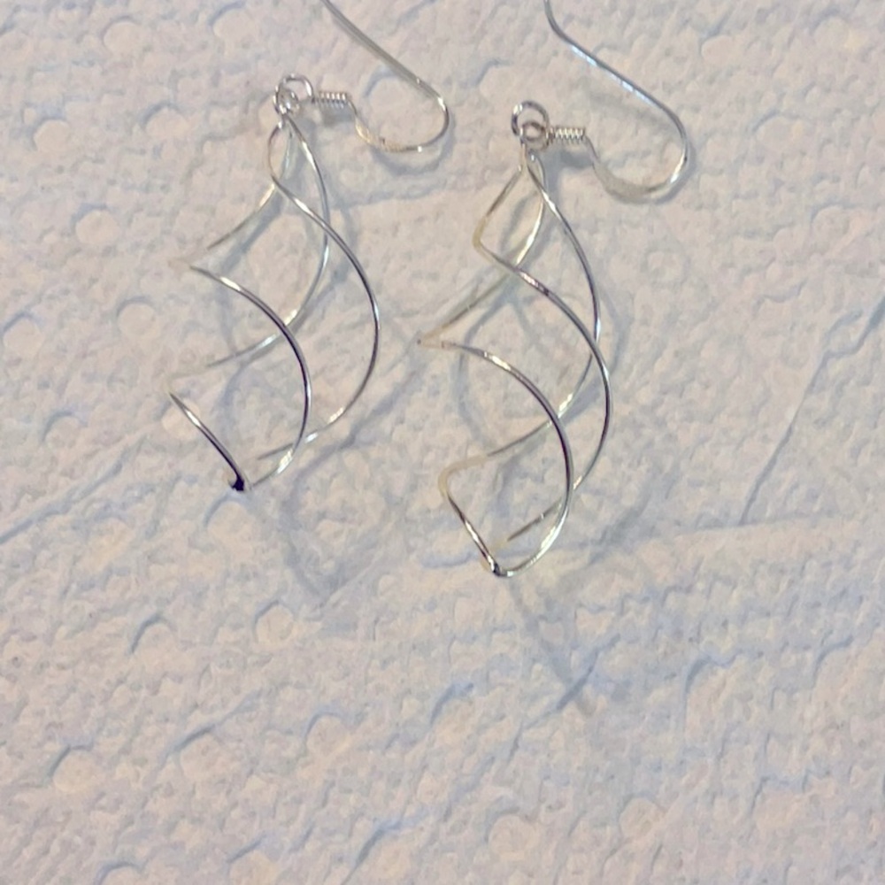 Silver plated dangle earrings that are 2 inches long and great condition.